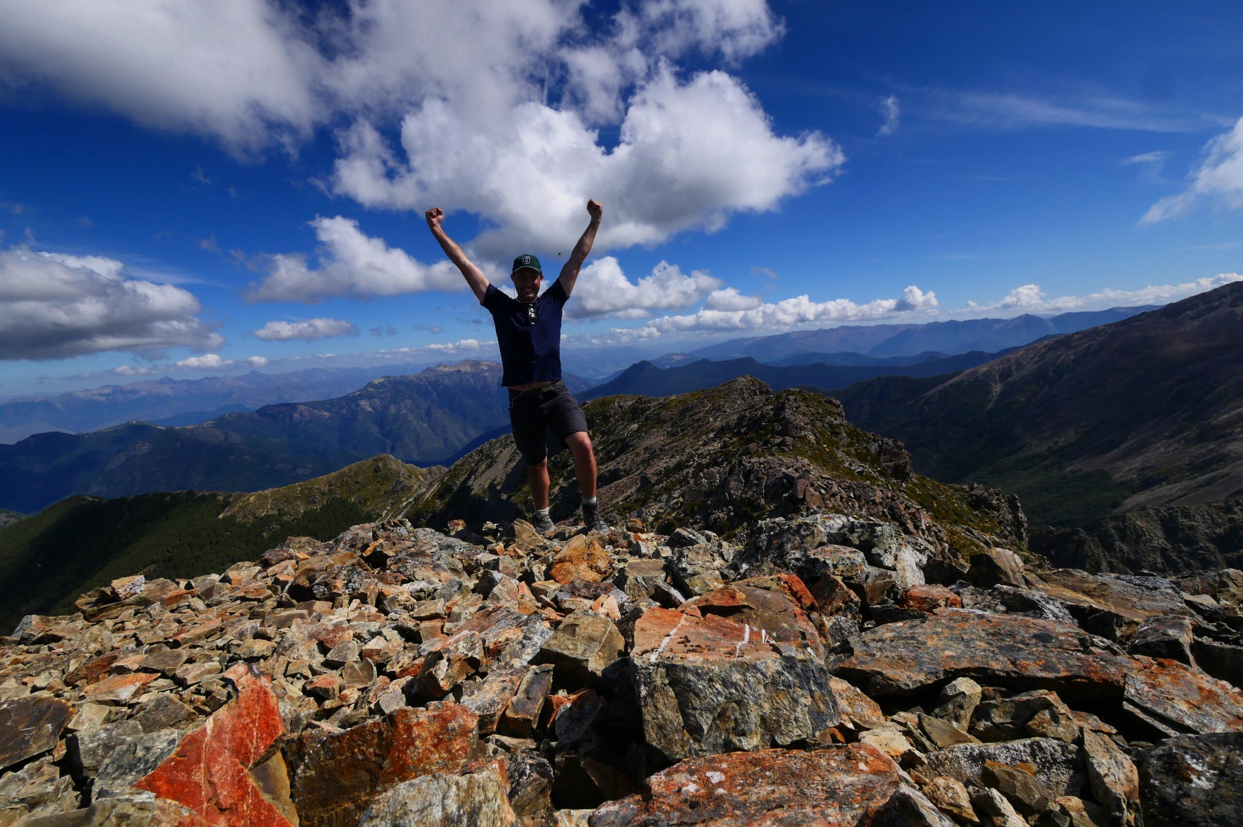 Hank celebrates his arrival atop Mount Rintoul in New Zealand's Richmond Range.