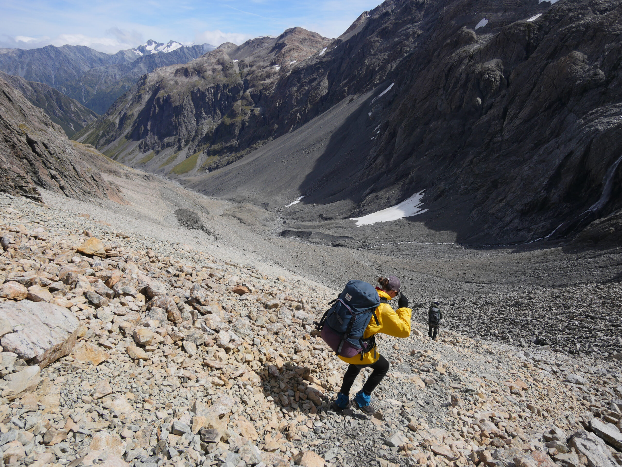 Julia and Stu climb down the west side of Whitehorn Pass in Arthur's Pass National Park, New Zealand.