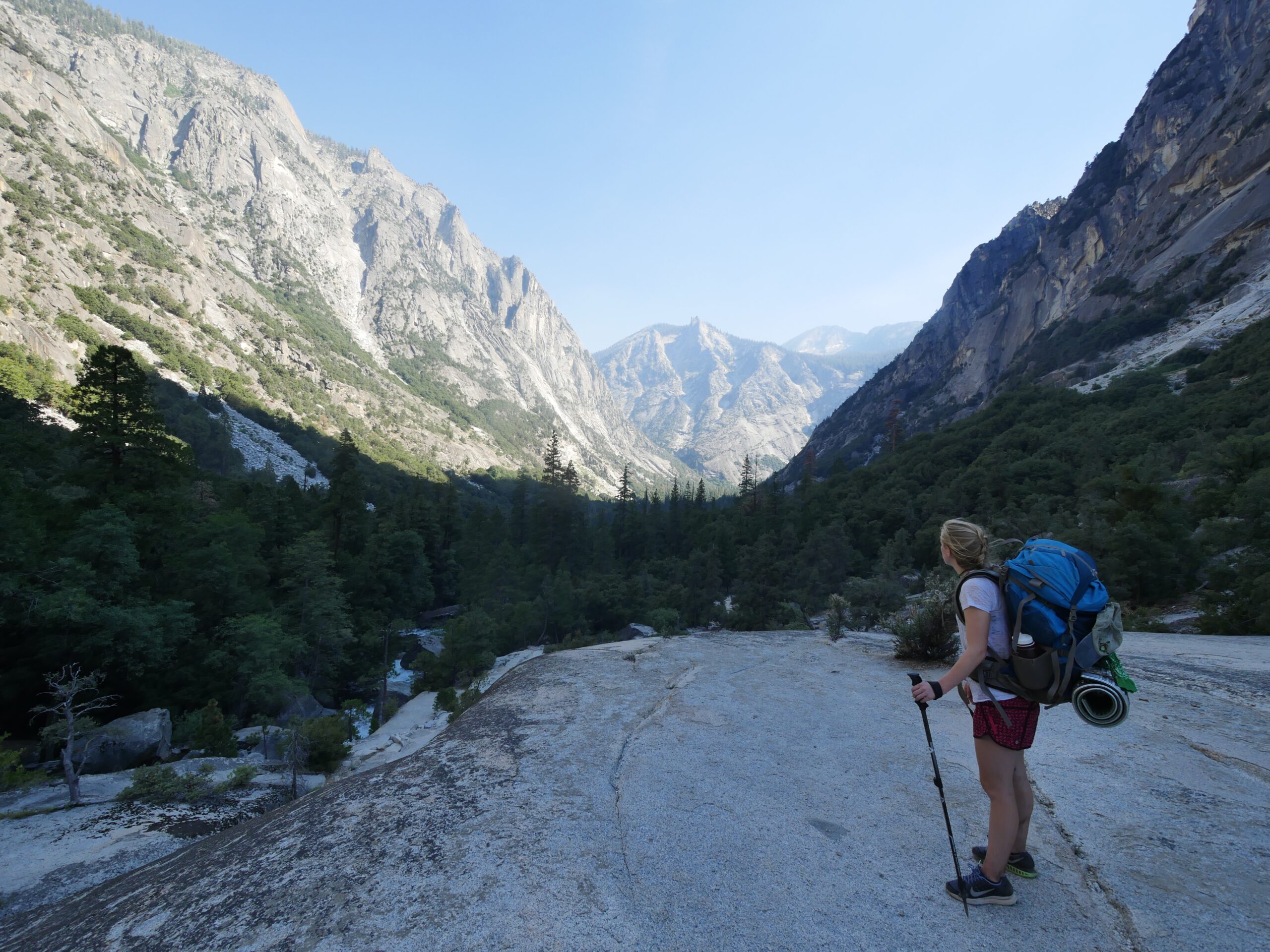 A hiker looks at a view of mountains in Paradise Valley, Kings Canyon National Park, California.