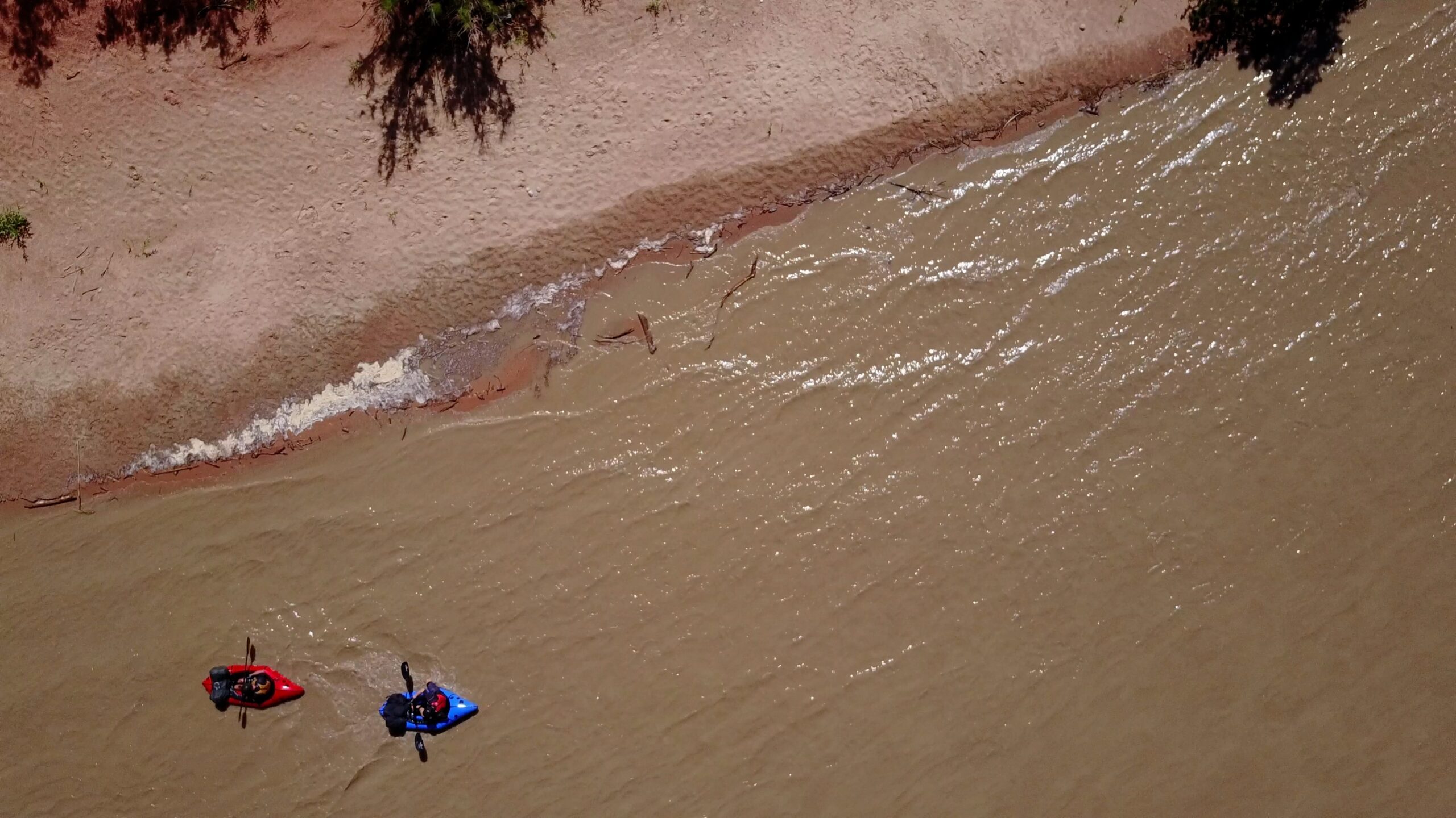Packrafters paddle down the San Juan River.