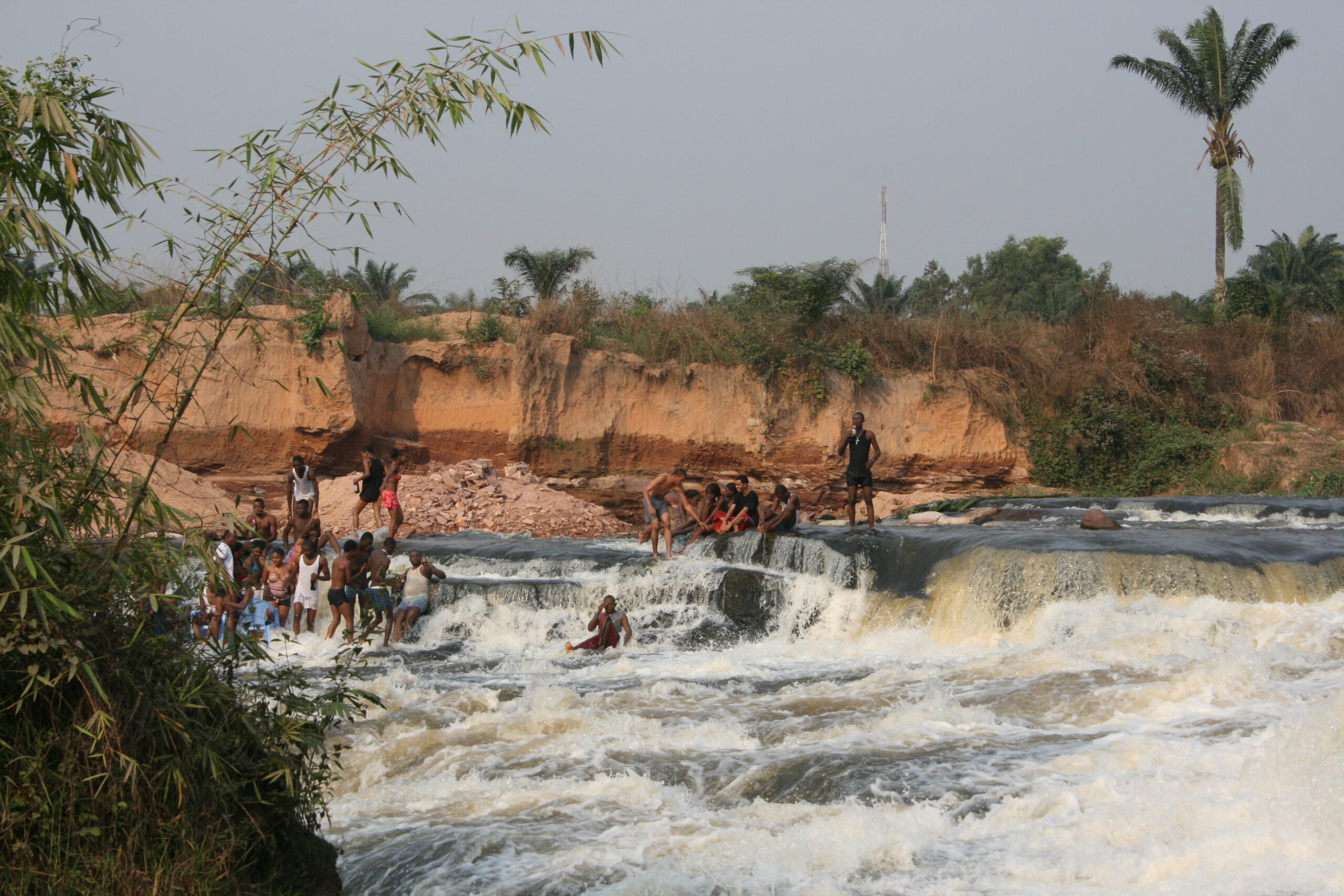 Teenagers playing in river rapids near Kinshasa