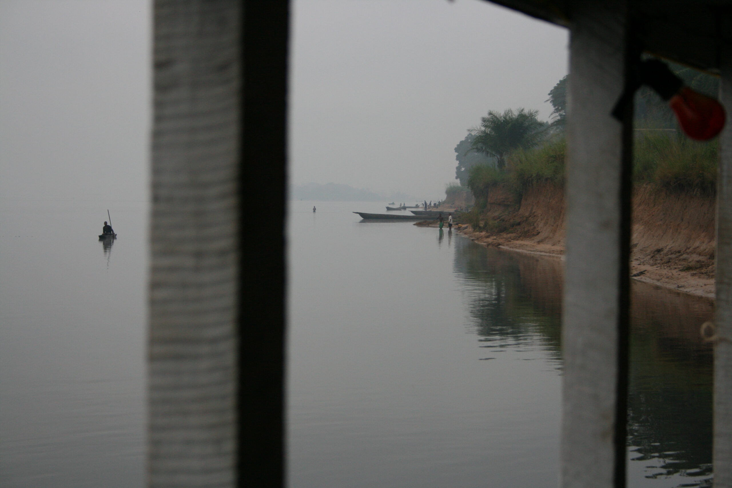 Pirogue, river view from boat near Isangi