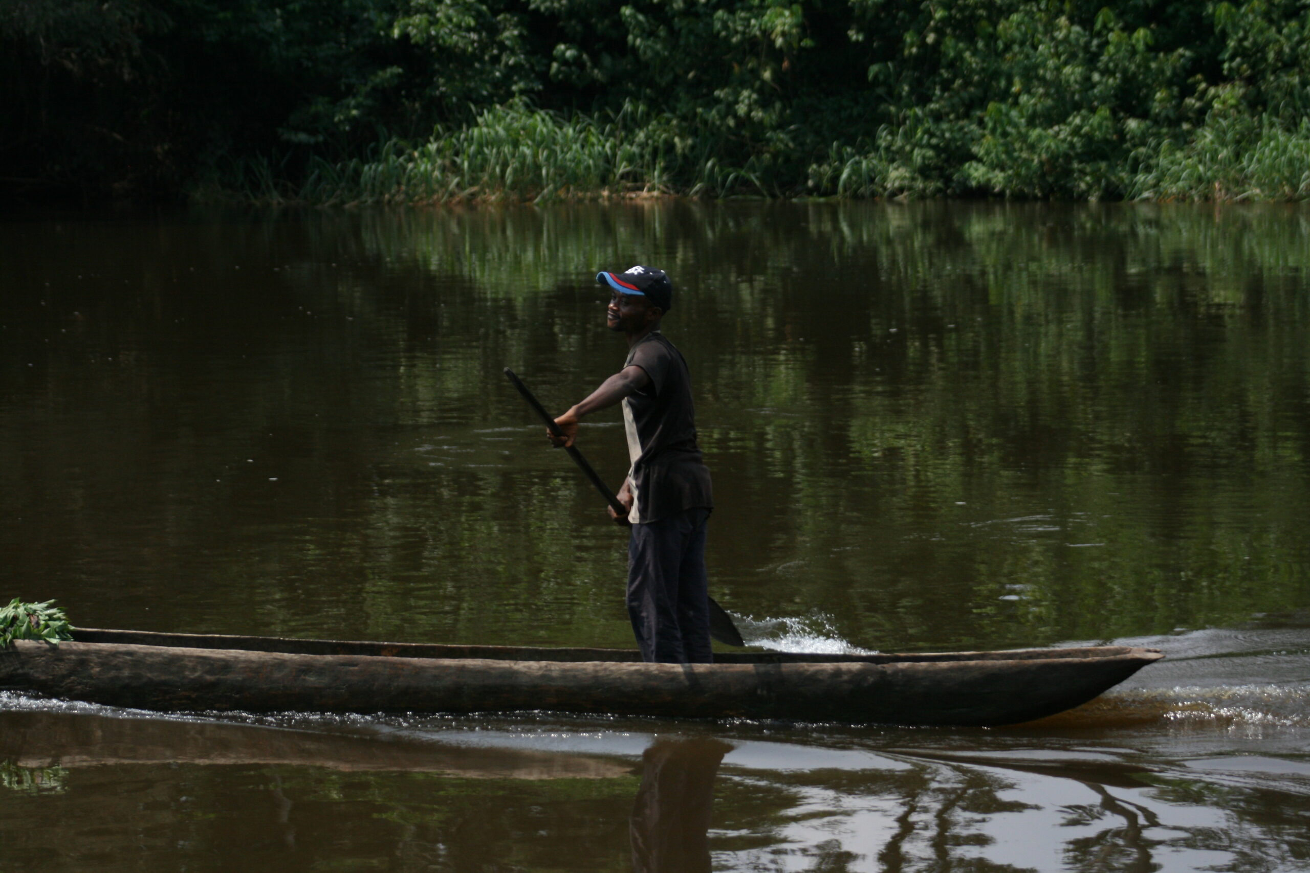 Man paddling pirogue