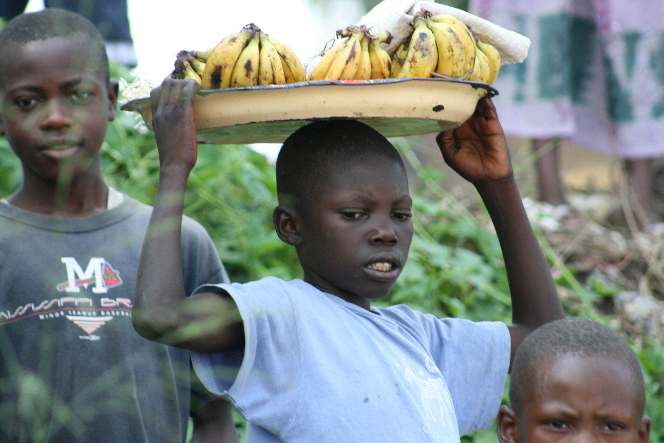 Child with bananas on head in Bumba