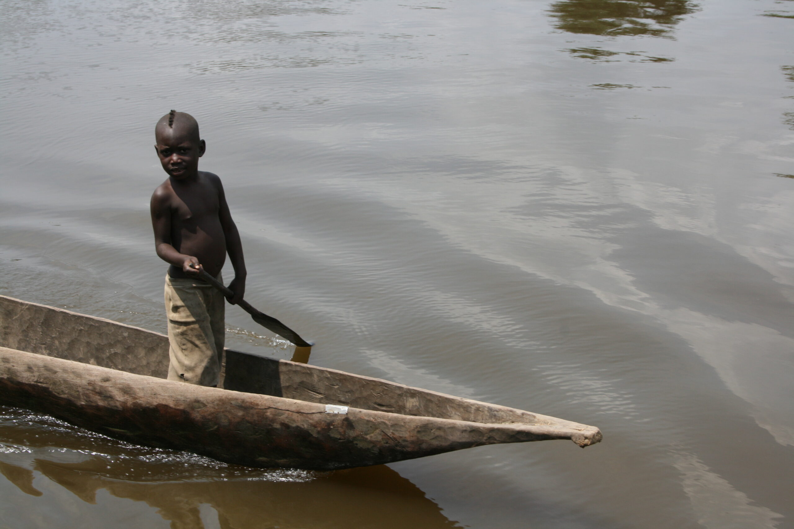 Child paddling pirogue