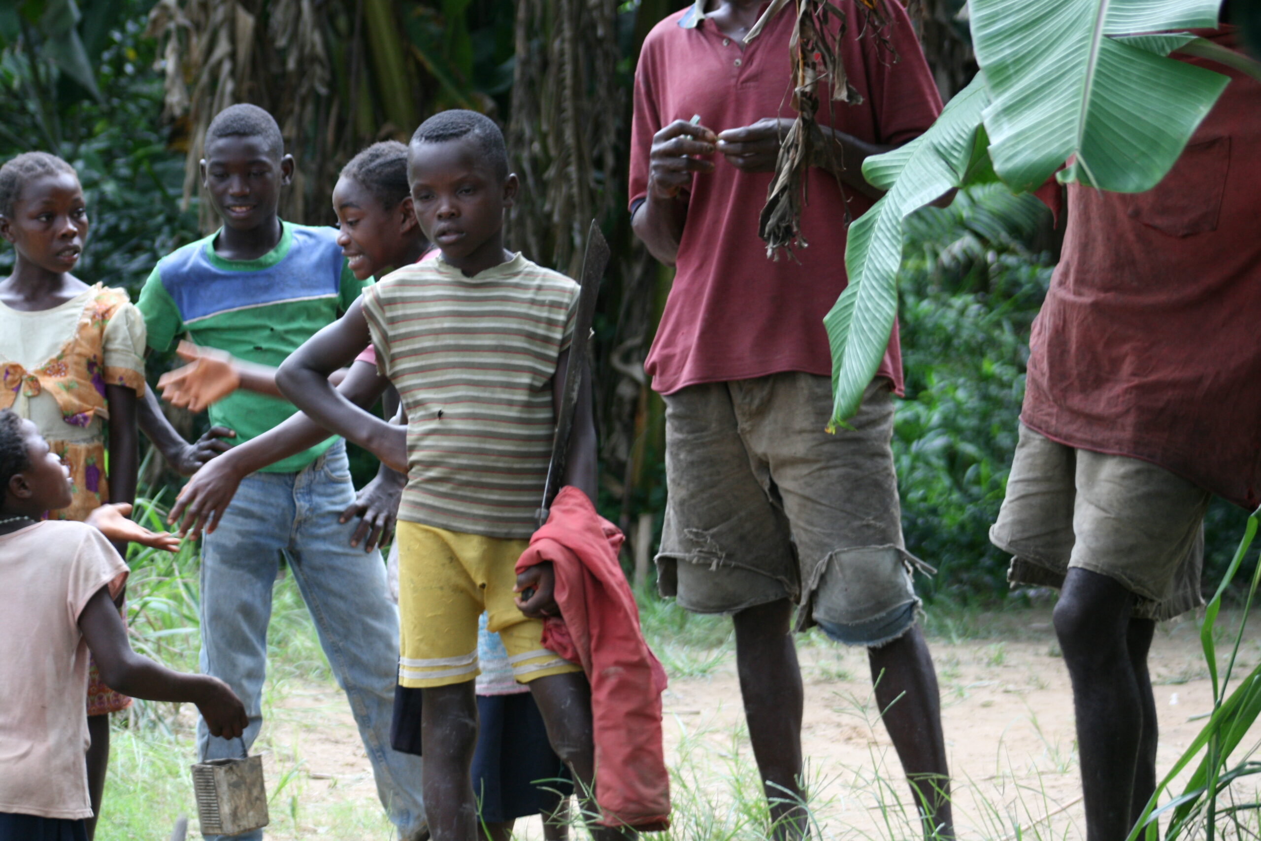 Child with machete in Ionde village