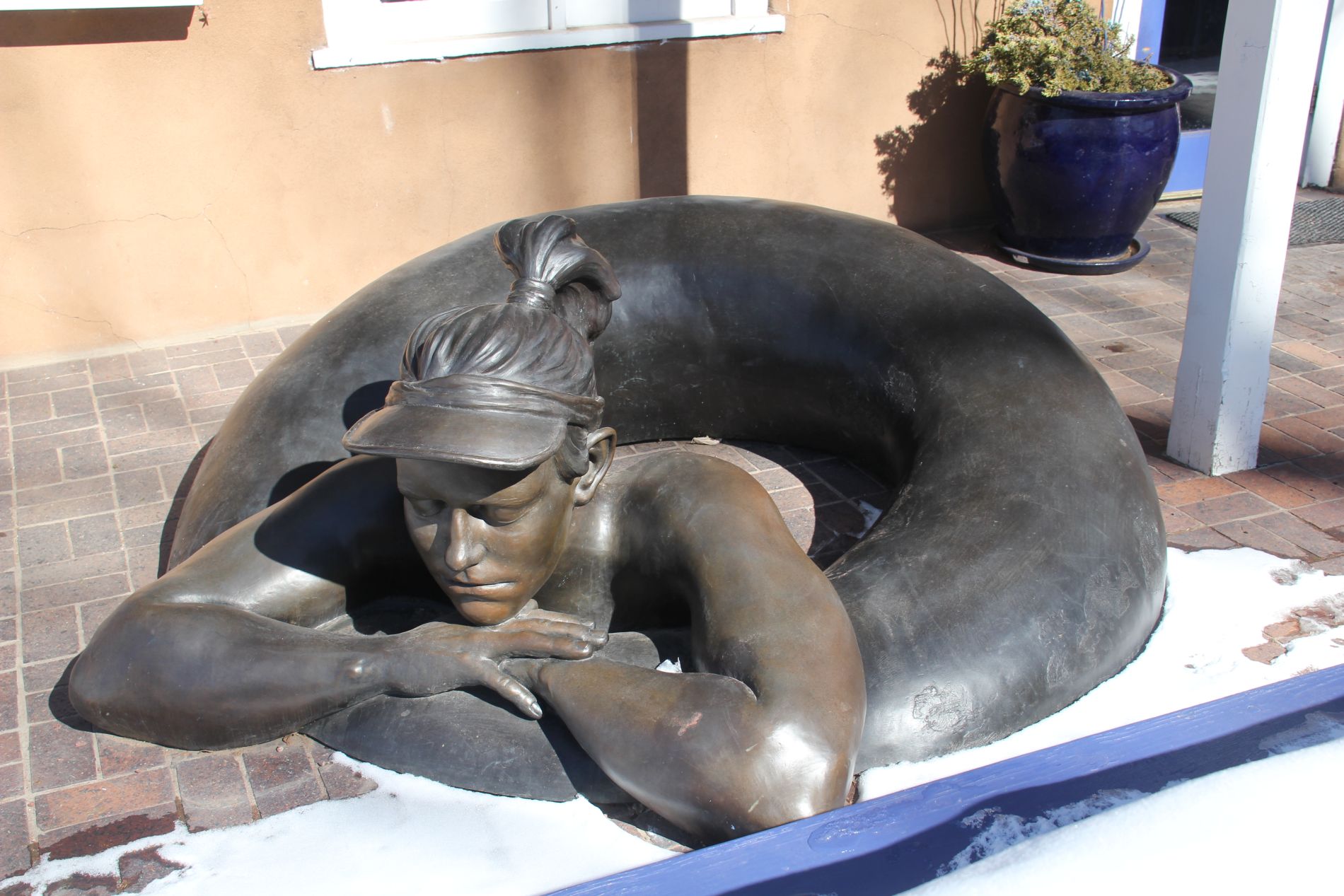 Woman on inner tube statue on Canyon Road in Santa Fe, New Mexico