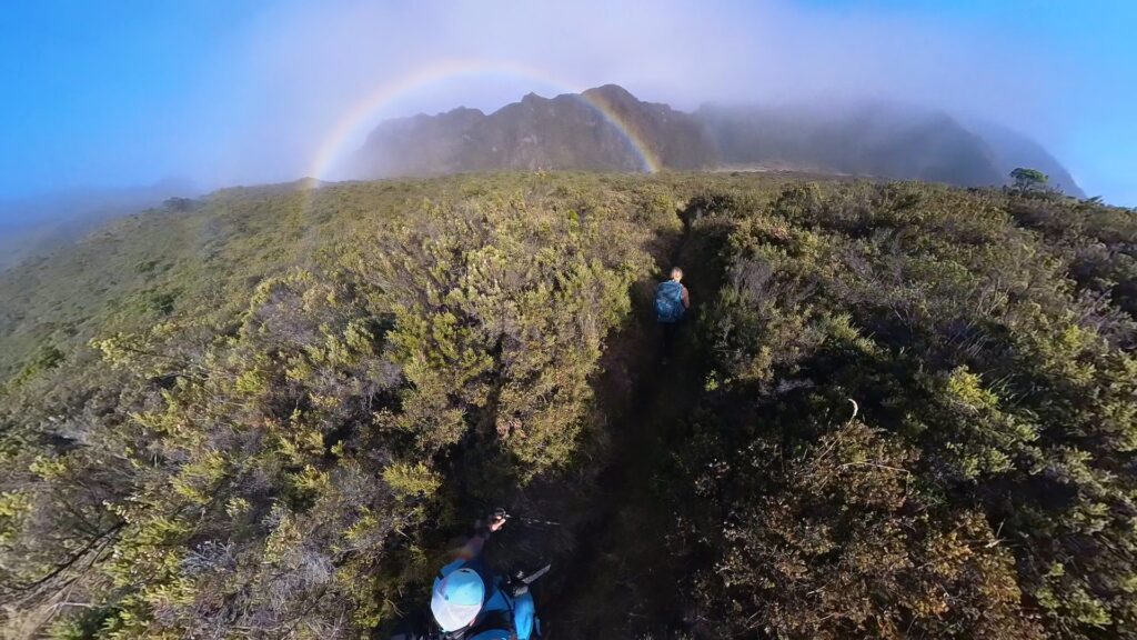 Hikers spot a rainbow in Haleakala National Park.