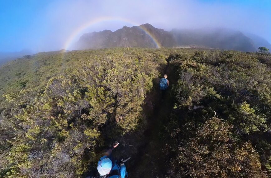 Hikers spot a rainbow in Haleakala National Park.