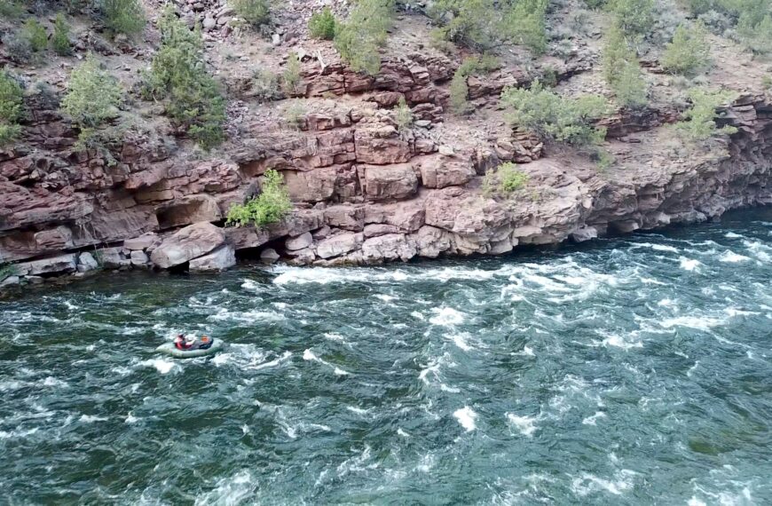 A packrafter runs Mother-In-Law Rapid in Flaming Gorge